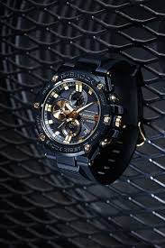 Casio G-Shock Bezal with Gold IP And two-toned black Dial Wave Ceptor MRG-G2000HB-1ADR Fancy For Men's